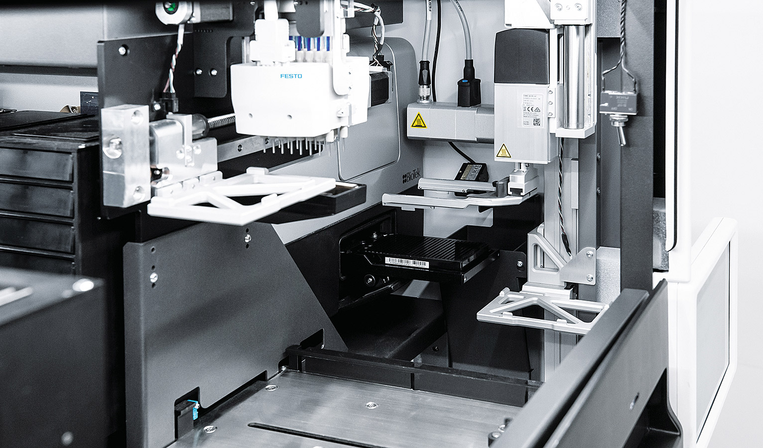 Several Festo dosing heads and handling portals are installed in the system.