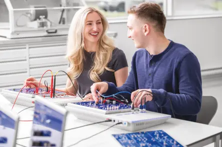 Students work happily with the Electeo learning solution