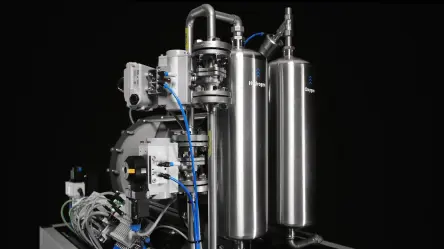 Compact industrial system with stainless steel tanks, valves and open-loop control for gas processing.