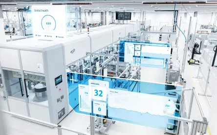 A bright, automated production hall with connected machines and digital monitoring dashboards.
