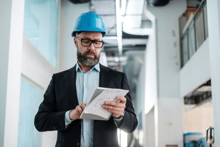 Middle-aged engineer in hardhat