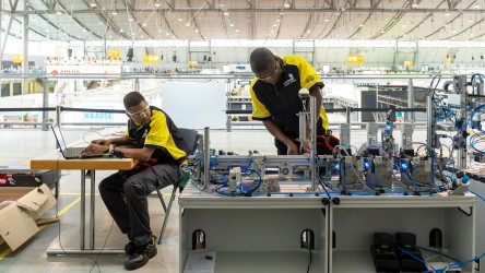 Competitors working on the MPS station 