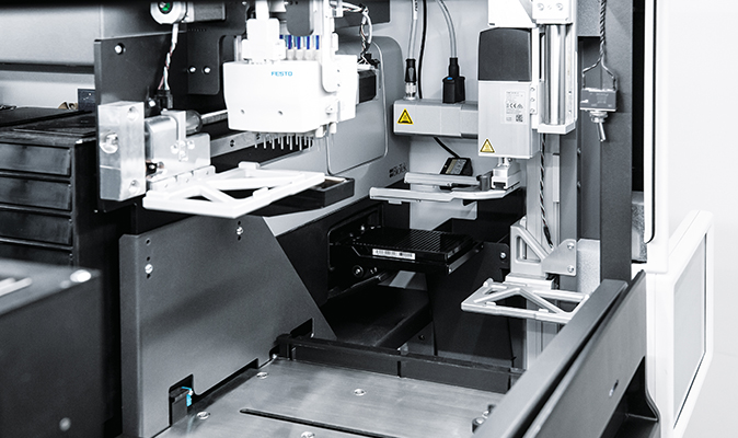 Several Festo dosing heads and handling portals are installed in the system.